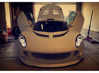 Illustration for article titled Praise All That Is Unholy: Here's A BMW V10 Swapped Into A Lotus Elise
